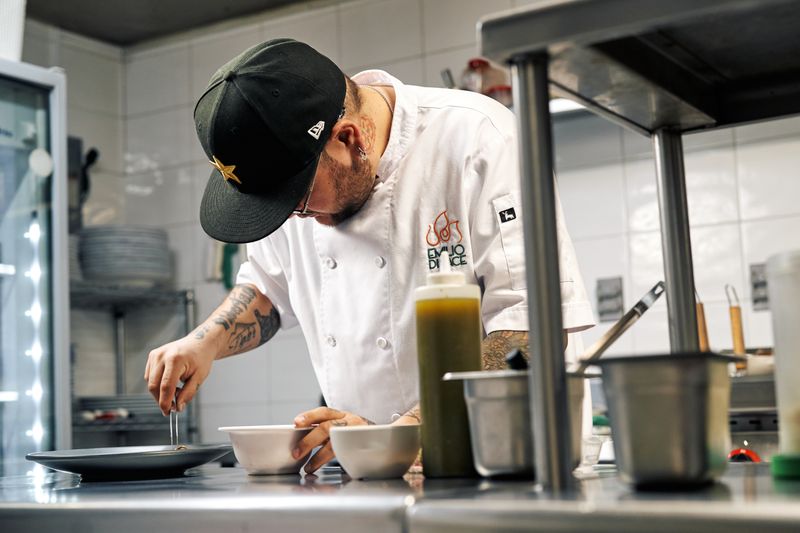 Chef Arturo preparing taco cabana style tacos in the kitchen