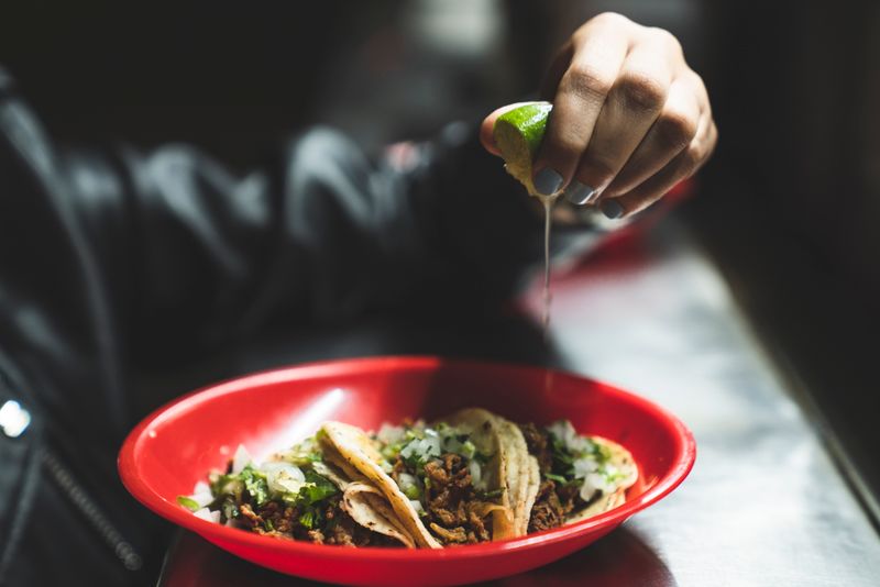 Spicy carnitas taco with chipotle sauce